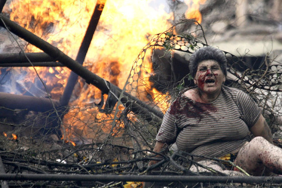 An injured Georgian woman shouts in the town of Gori
